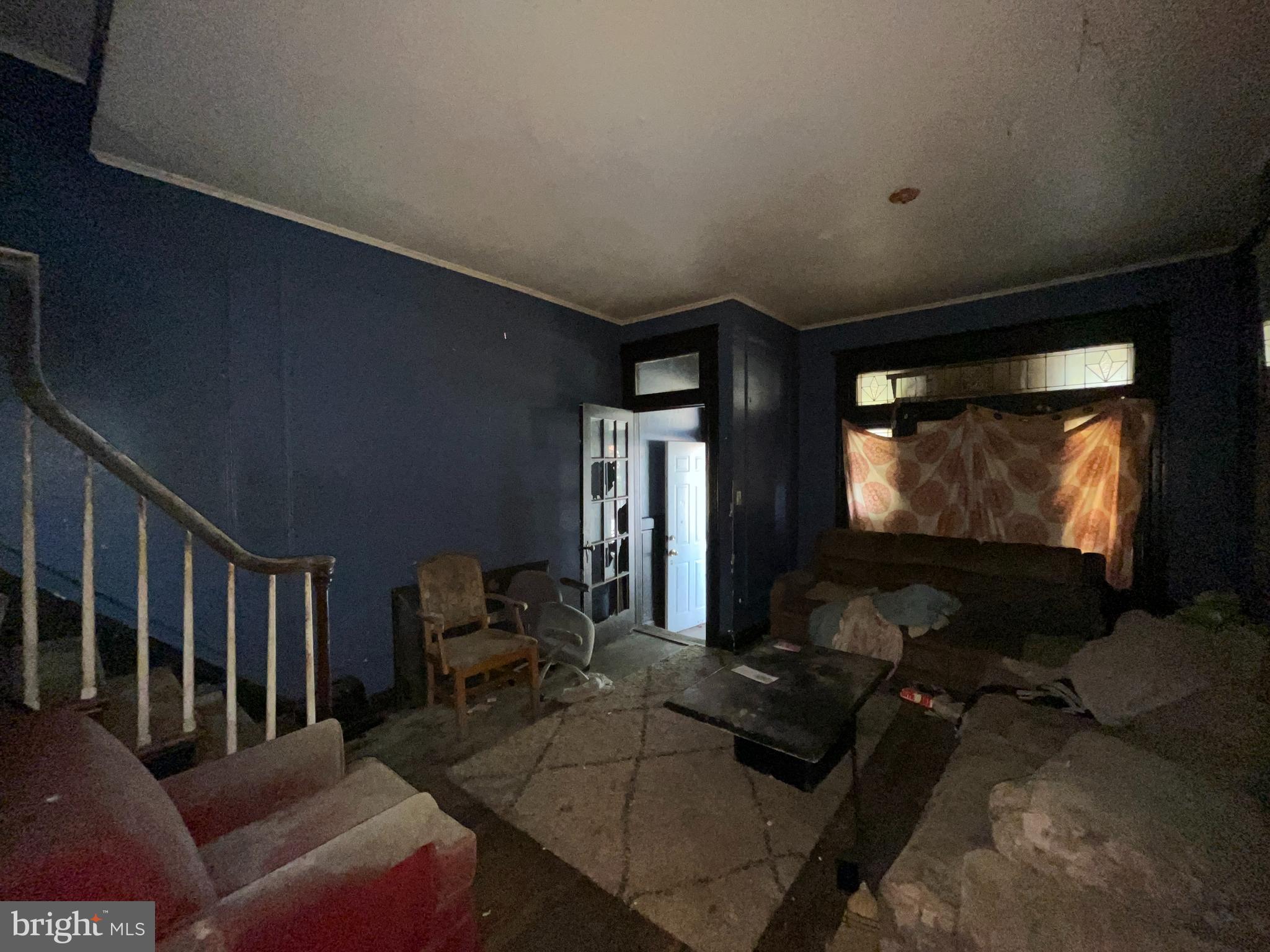 2807 Winchester Street Baltimore, MD 21216 - Photo 4 of 16 a living room with furniture and a flat screen tv