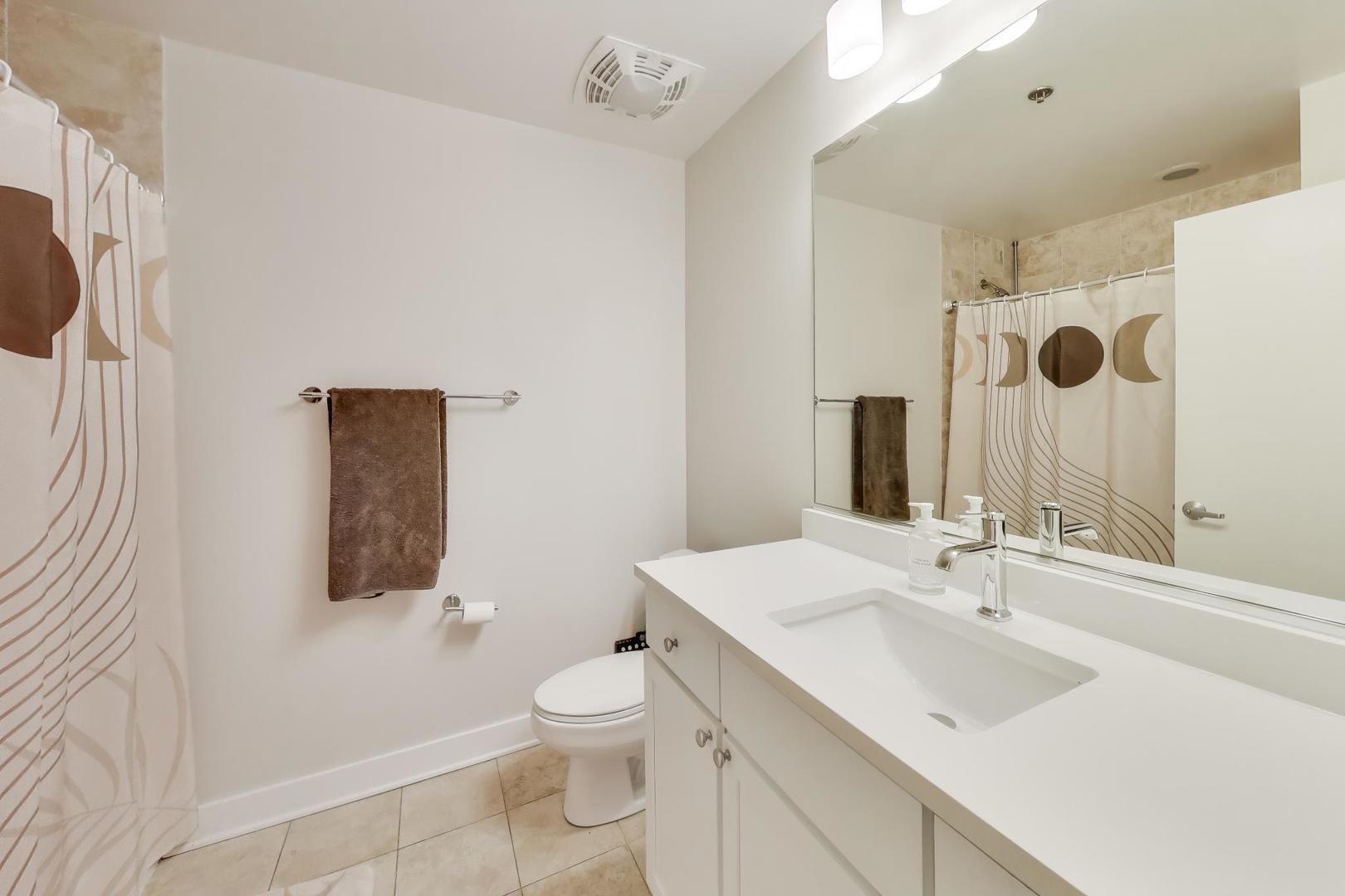901 West Madison Street, Unit 710 Chicago, IL 60607 - Photo 15 of 35 a bathroom with a sink toilet and shower