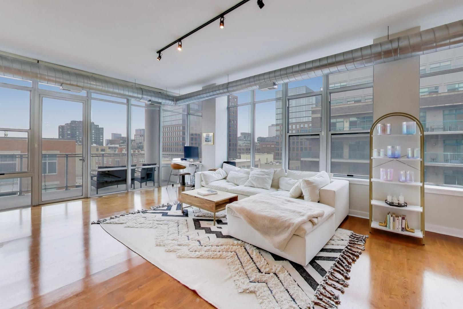 901 West Madison Street, Unit 710 Chicago, IL 60607 - Photo 2 of 35 a living room with furniture and a large window