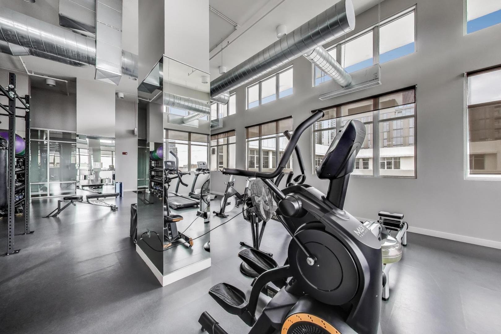 901 West Madison Street, Unit 710 Chicago, IL 60607 - Photo 21 of 35 a view of a room with gym equipment