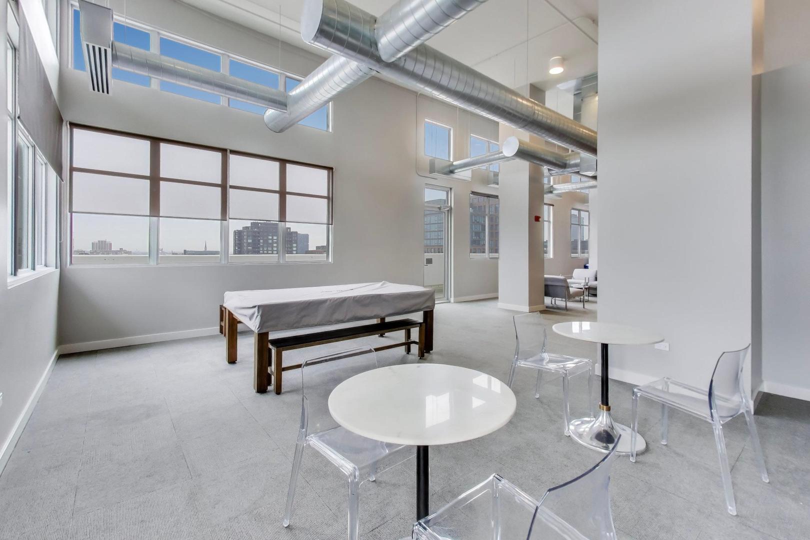 901 West Madison Street, Unit 710 Chicago, IL 60607 - Photo 22 of 35 a room with gym equipment and windows
