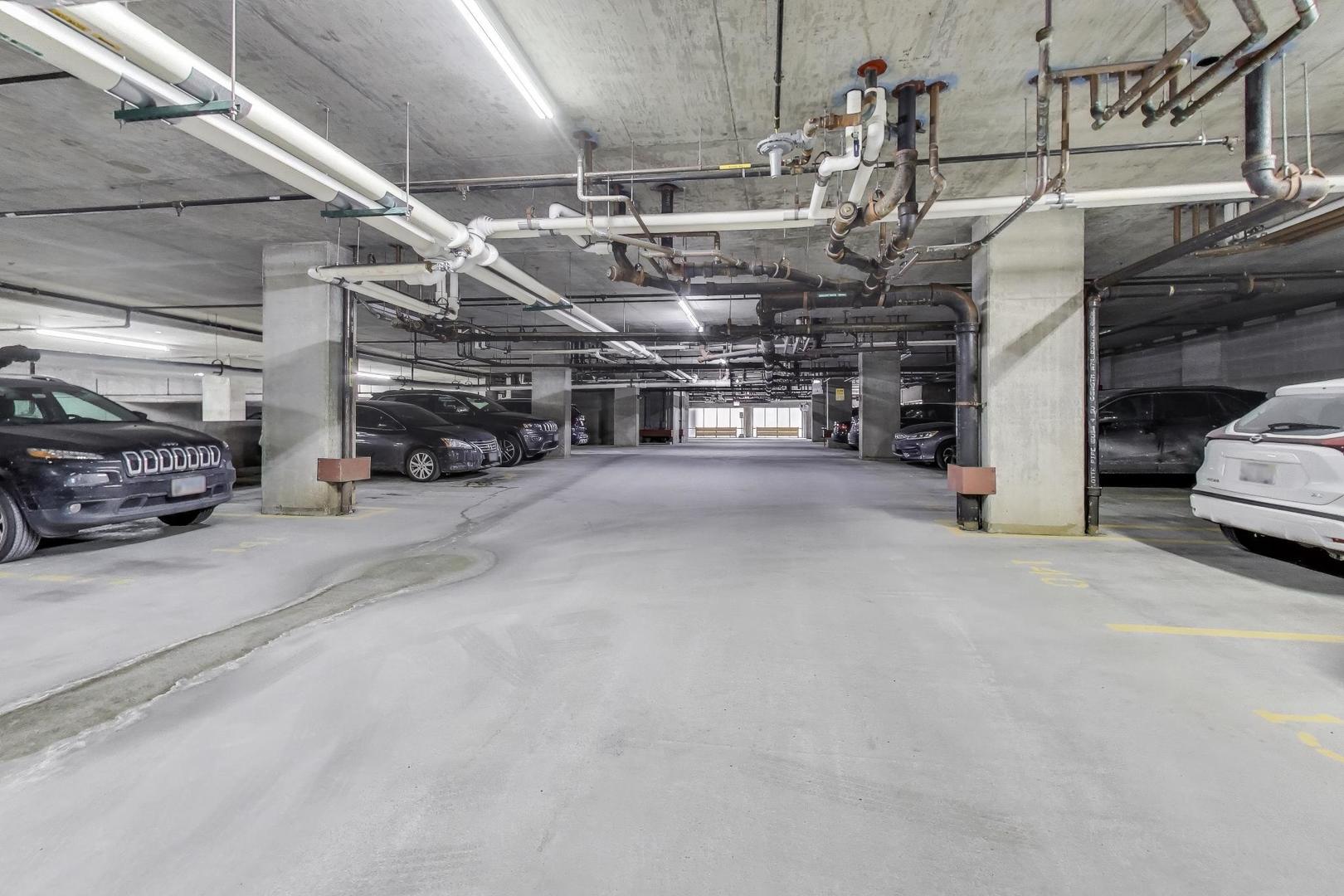 901 West Madison Street, Unit 710 Chicago, IL 60607 - Photo 25 of 35 a view of parking garage with cars