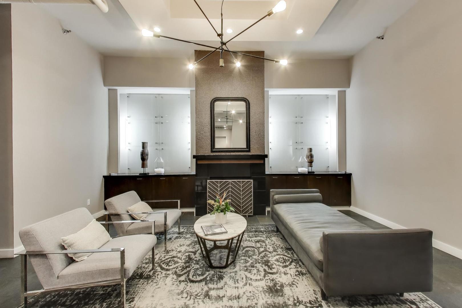 901 West Madison Street, Unit 710 Chicago, IL 60607 - Photo 26 of 35 a living room with furniture and a fireplace