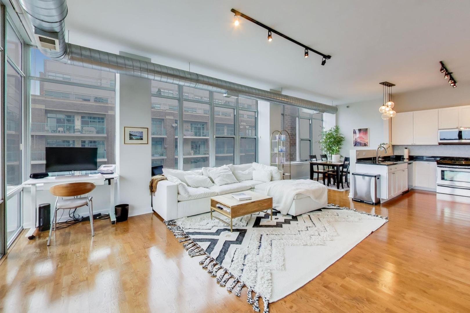 901 West Madison Street, Unit 710 Chicago, IL 60607 - Photo 4 of 35 a living room with furniture and a large window