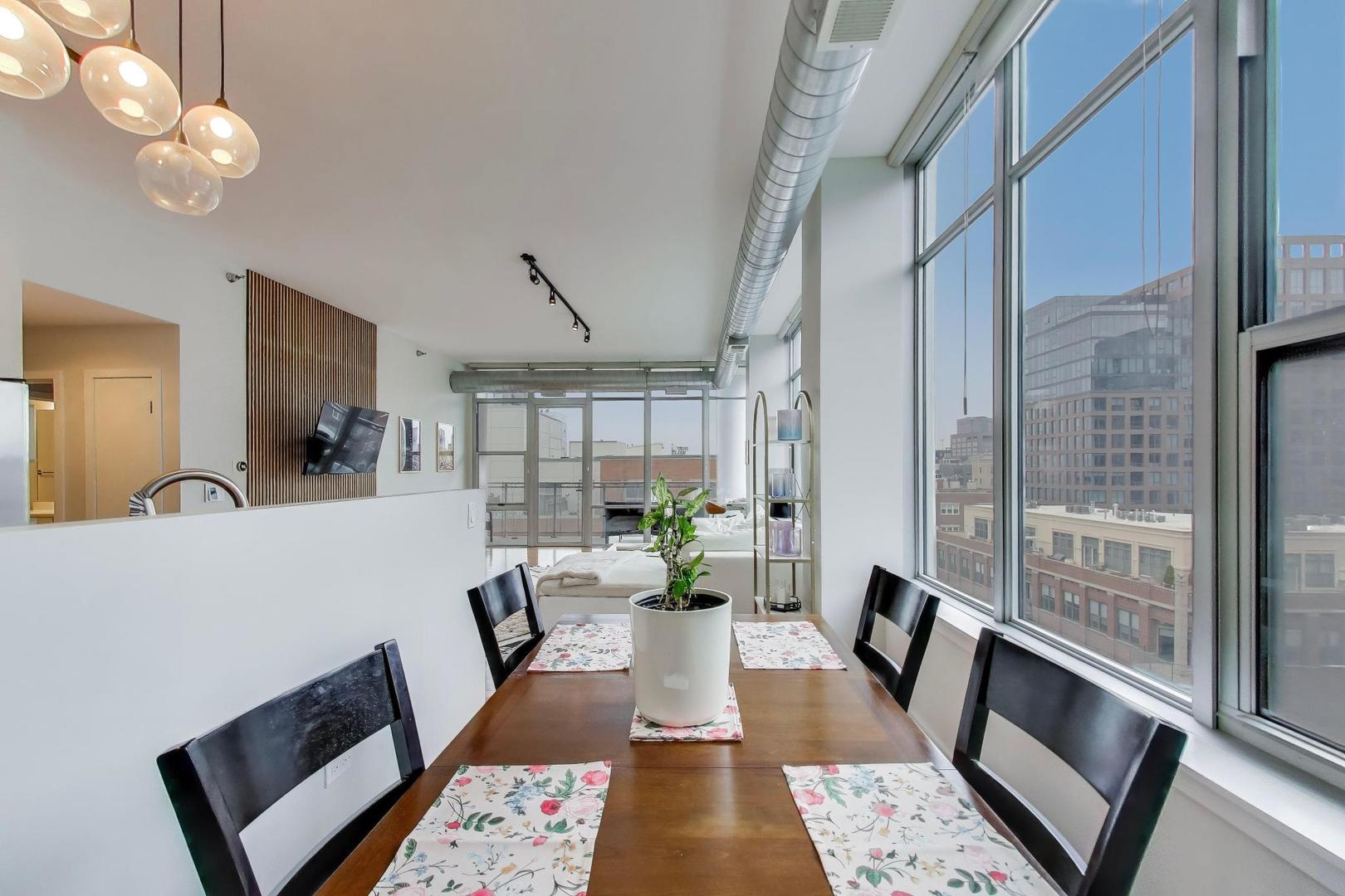 901 West Madison Street, Unit 710 Chicago, IL 60607 - Photo 7 of 35 a living room with furniture and a chandelier