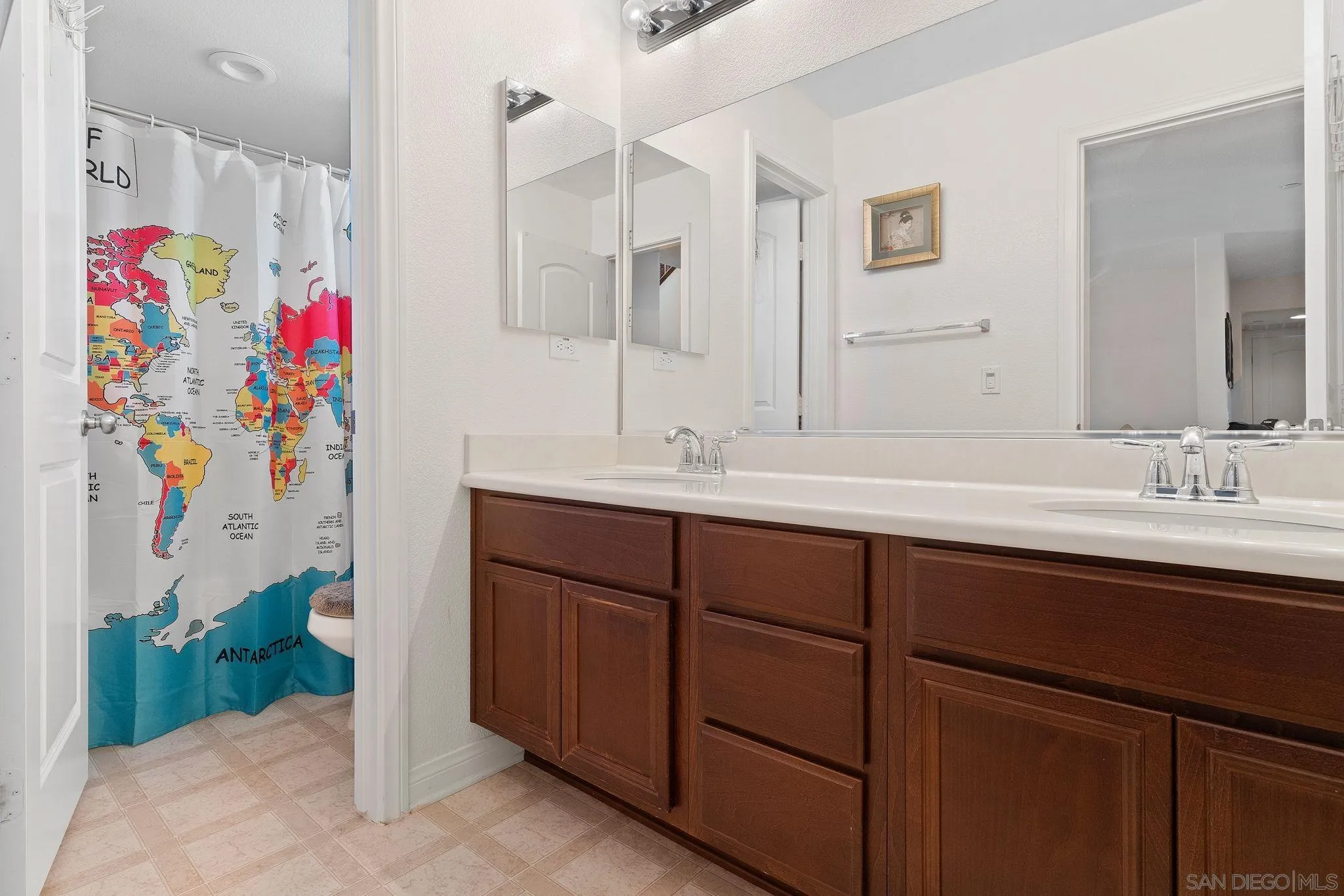 1438 Pershing Road Chula Vista, CA 91913 - Photo 11 of 45 a bathroom with a sink mirror and vanity
