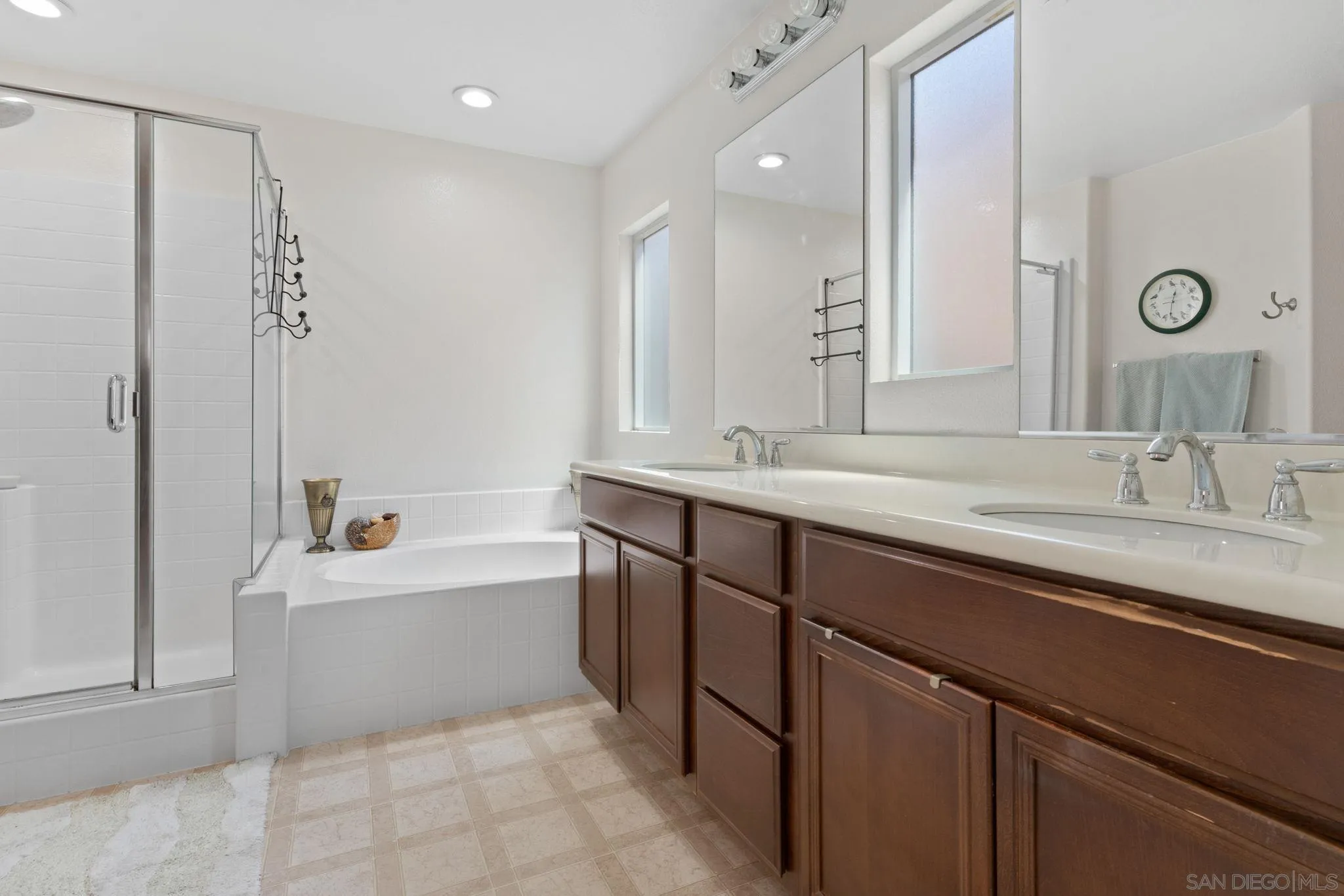 1438 Pershing Road Chula Vista, CA 91913 - Photo 15 of 45 a bathroom with a sink double vanity mirror and a bathtub