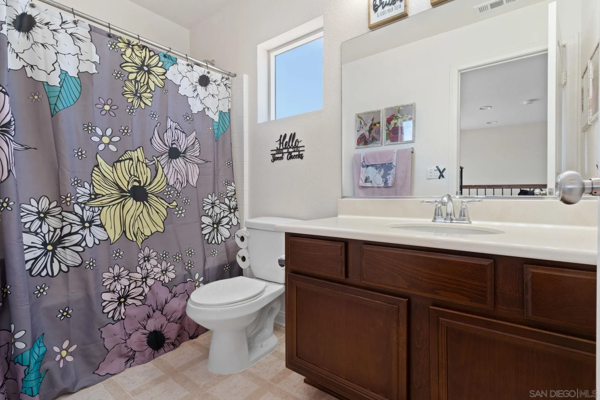 1438 Pershing Road Chula Vista, CA 91913 - Photo 18 of 45 a bathroom with a sink a toilet and a mirror