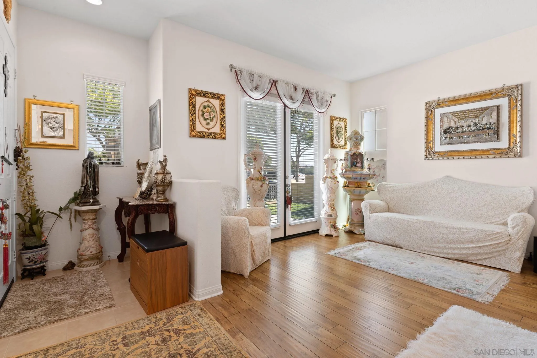 1438 Pershing Road Chula Vista, CA 91913 - Photo 2 of 45 a living room with furniture a flat screen tv and a refrigerator
