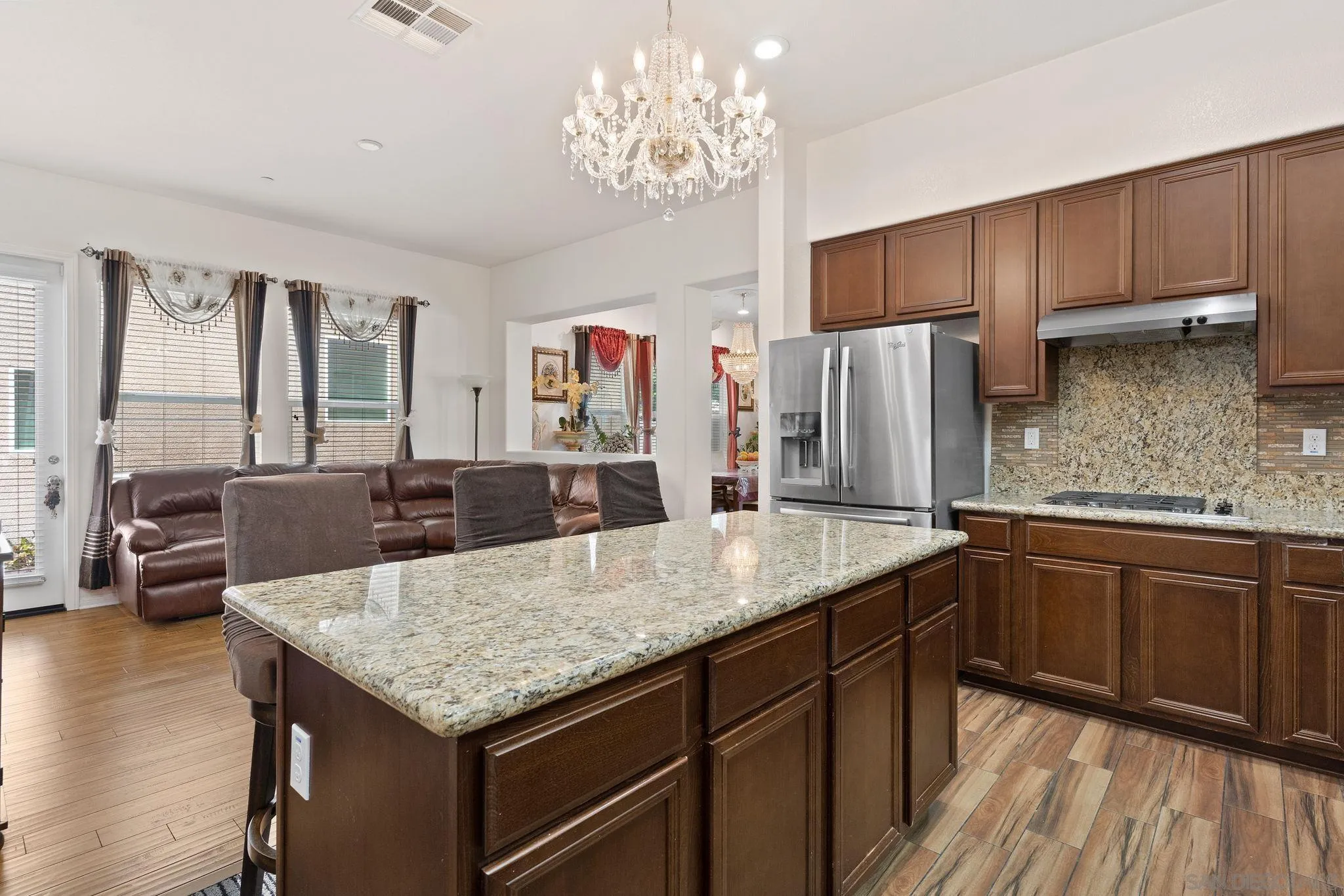 1438 Pershing Road Chula Vista, CA 91913 - Photo 9 of 45 a kitchen with center island and large windows