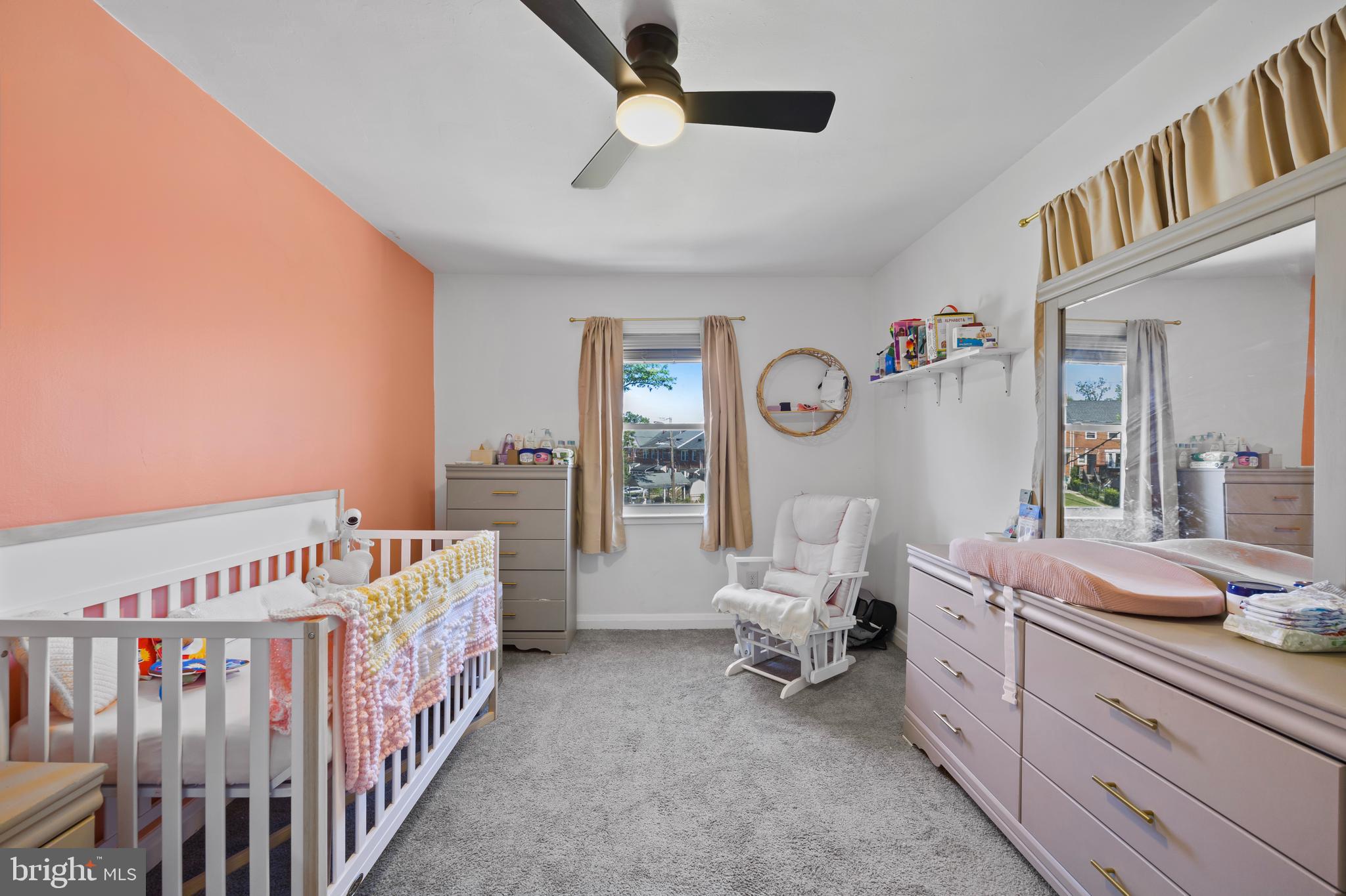 4511 Marble Hall Road Baltimore, MD 21239 - Photo 28 of 48 a bedroom with furniture a baby crib and a window