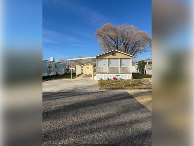 3251 E Road, Unit 11 Clifton, CO 81520 - Photo 2 of 15 a view of a house with a snow in a yard
