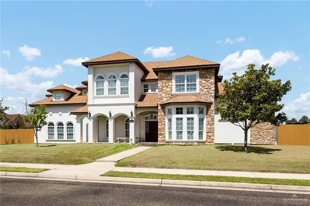 front view of a house with a yard
