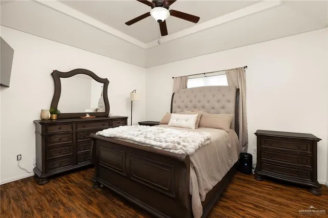 a bedroom with a bed and a dresser