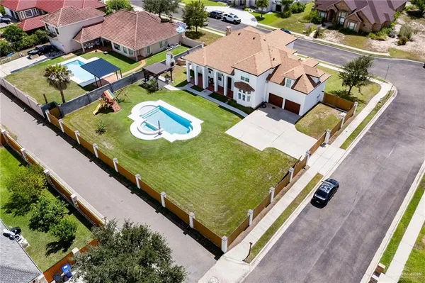 an aerial view of a house with swimming pool