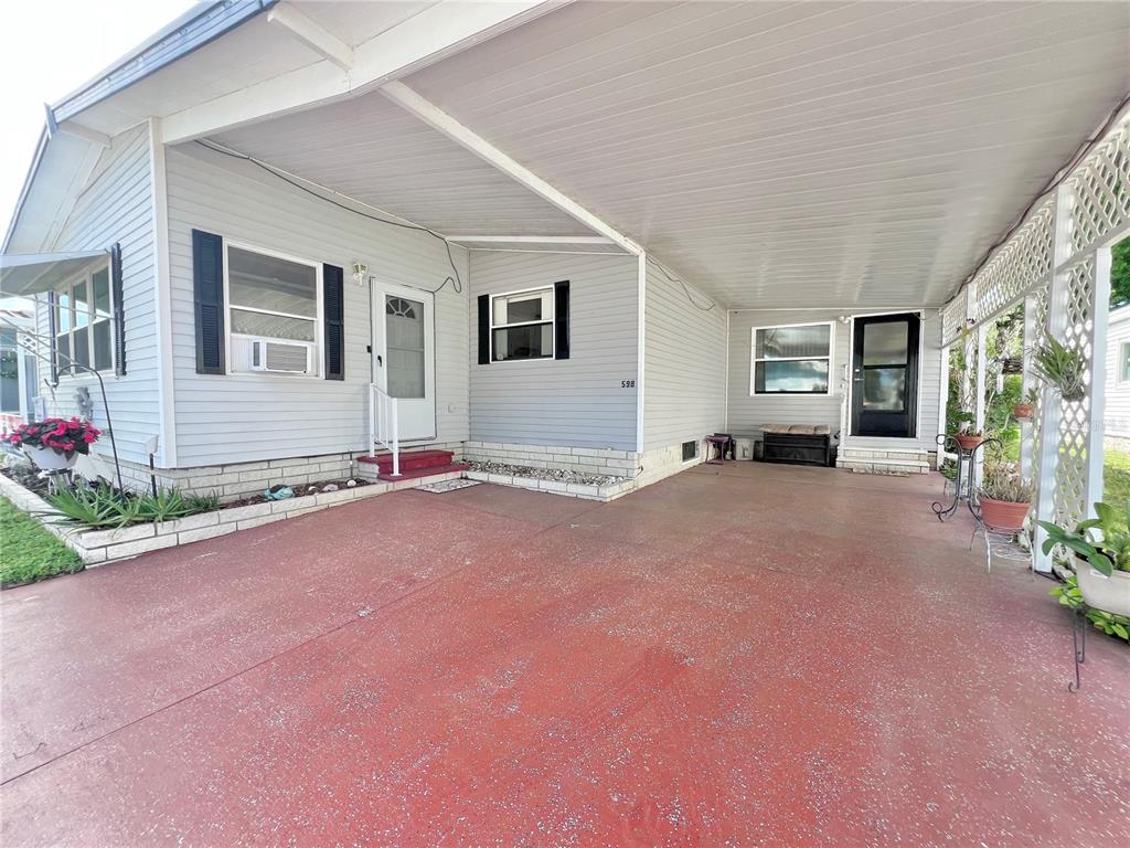 1001 Starkey Road, Unit 598 Largo, FL 33771 - Photo 1 of 1 Exterior Front extra wide driveway