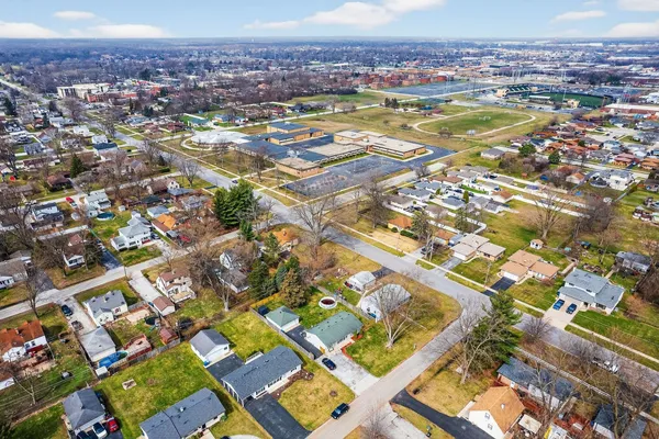 an aerial view of residential houses with outdoor space
