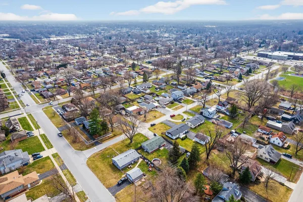 an aerial view of residential houses with outdoor space