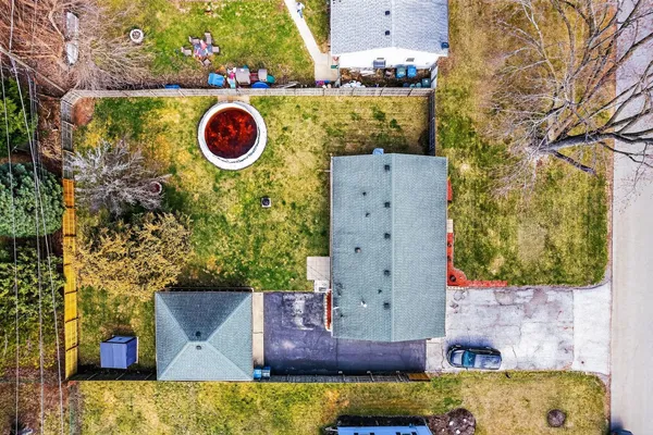 an aerial view of residential houses with outdoor space