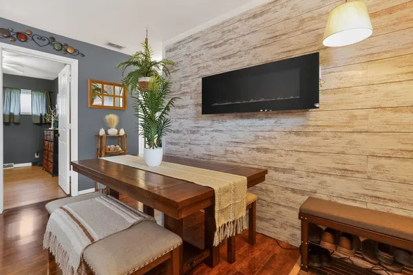 a living room with fireplace furniture and a flat screen tv