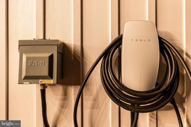 a living room with fireplace furniture and a large window