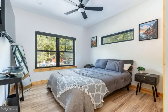 a bed room with a bed and a chandelier