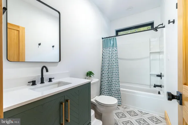 a view of a dining table and chairs on the roof deck