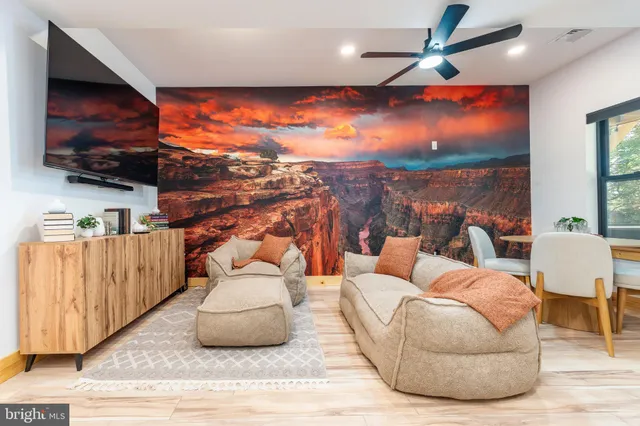 a backyard of a house with barbeque oven table and chairs