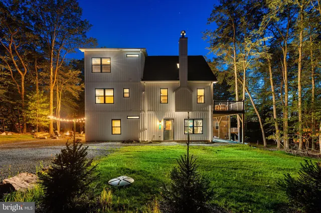a view of a kitchen with a large window and furniture