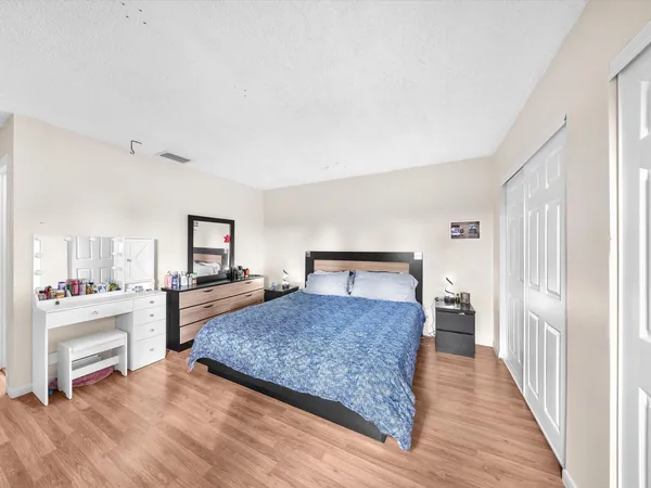a bedroom with a bed and a view of bathroom