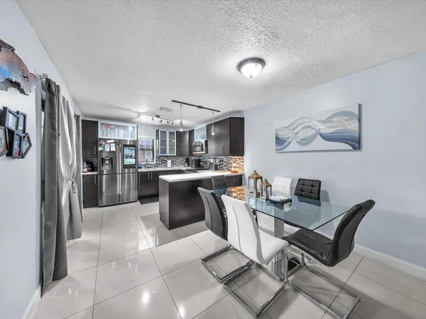 a view of a dining room kitchen and a window
