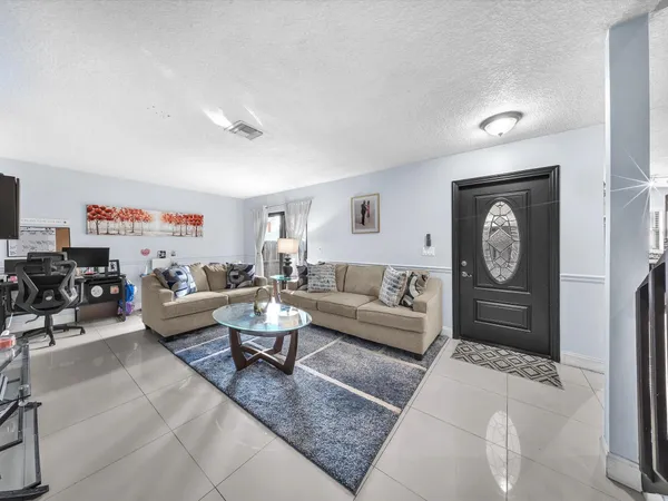 a living room with furniture and a window