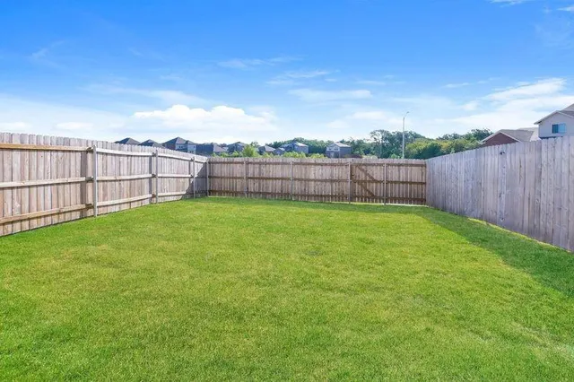 a view of a backyard with a small yard