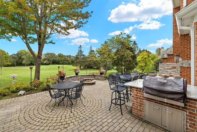 a view of a patio with chairs and a table