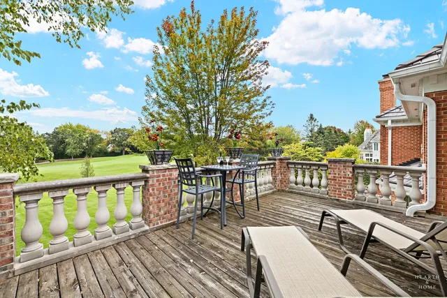 a aerial view of a house with a yard and lake view