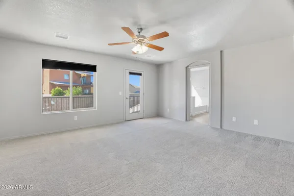 a view of a balcony with wooden floor