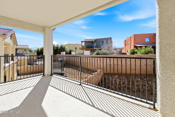 a view of balcony with furniture