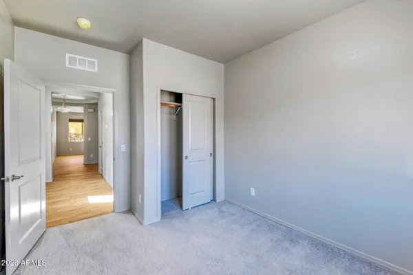 a bathroom with a granite countertop sink toilet a mirror and shower