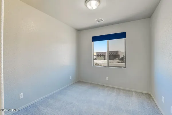 a kitchen with a refrigerator and a stove top oven