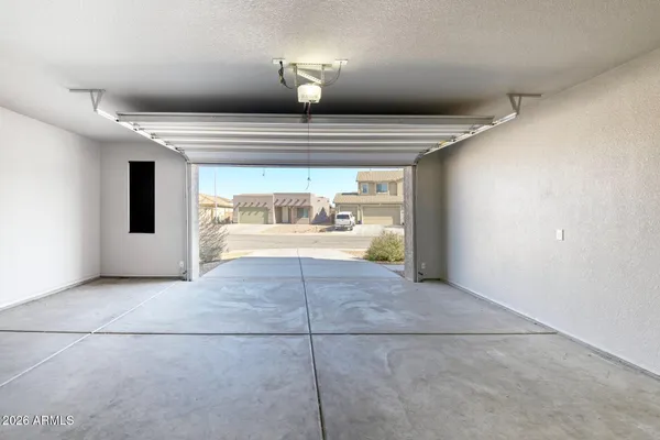 a spacious bathroom with a granite countertop sink and a mirror