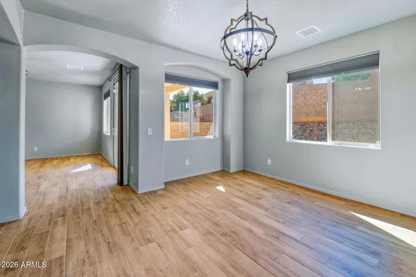 a view of a kitchen with a sink and a refrigerator