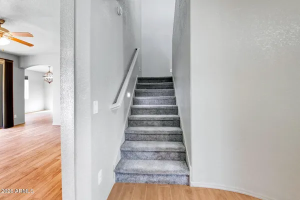 a big house with a big yard and large trees