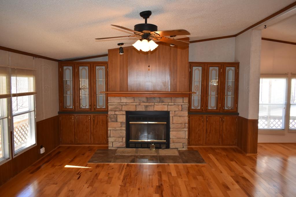 89 Dog Branch Road Pleasant Shade, TN 37145 - Photo 2 of 11 a living room with furniture and a fireplace