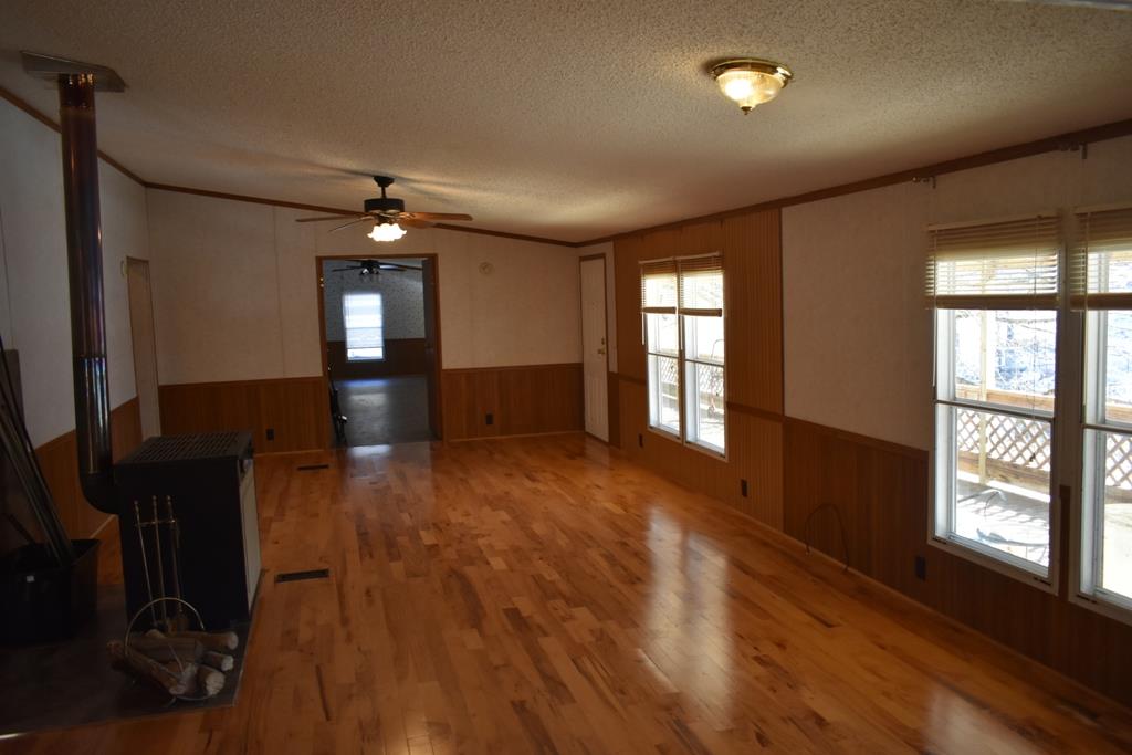 89 Dog Branch Road Pleasant Shade, TN 37145 - Photo 3 of 11 a view of empty room with wooden floor and fan