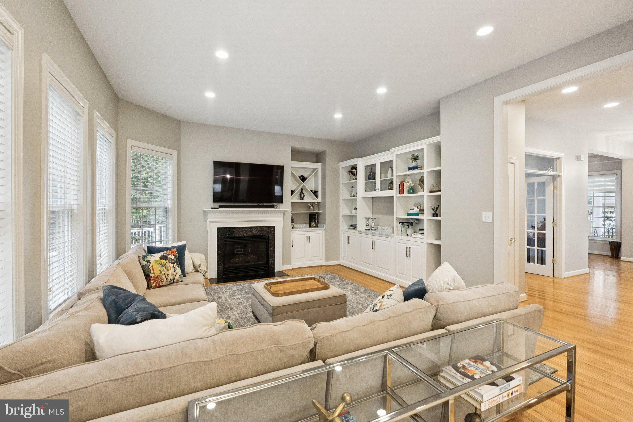 503 Autumn Wind Way Rockville, MD 20850 - Photo 11 of 83 a living room with furniture fireplace and flat screen tv