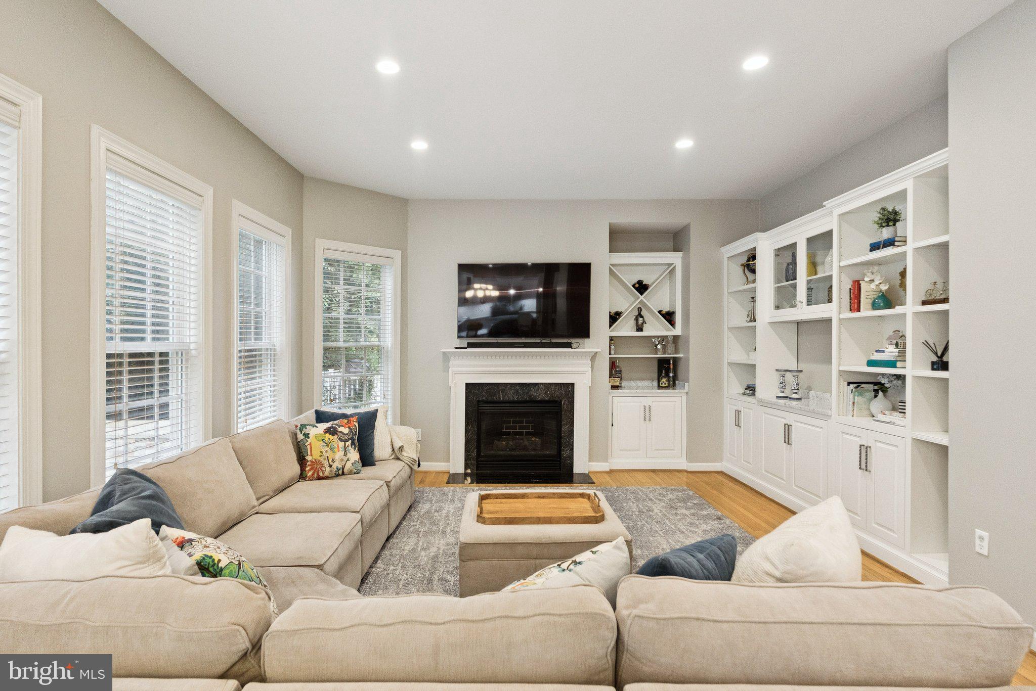 503 Autumn Wind Way Rockville, MD 20850 - Photo 12 of 83 a living room with furniture fireplace and flat screen tv