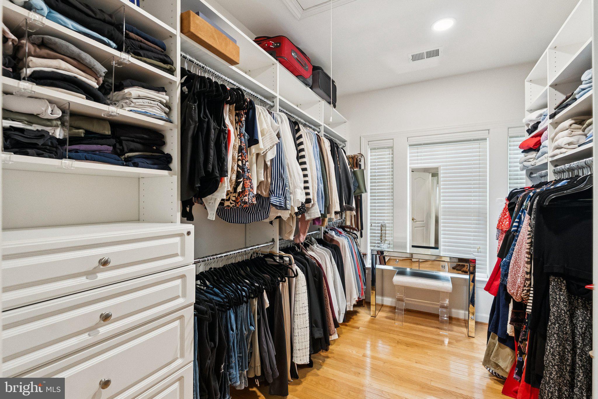 503 Autumn Wind Way Rockville, MD 20850 - Photo 35 of 83 a view of walk in closet with clothes and shoes