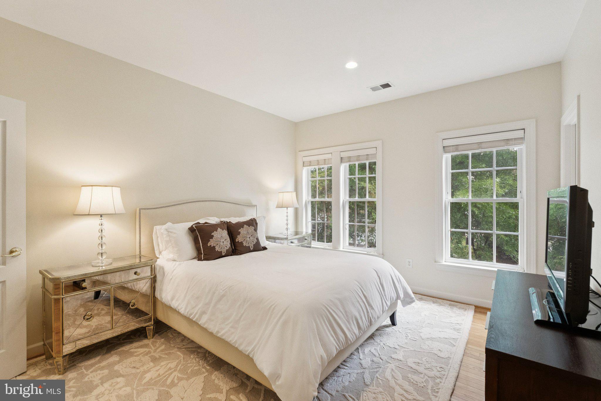 503 Autumn Wind Way Rockville, MD 20850 - Photo 37 of 83 a bedroom with a bed flat screen tv and windows