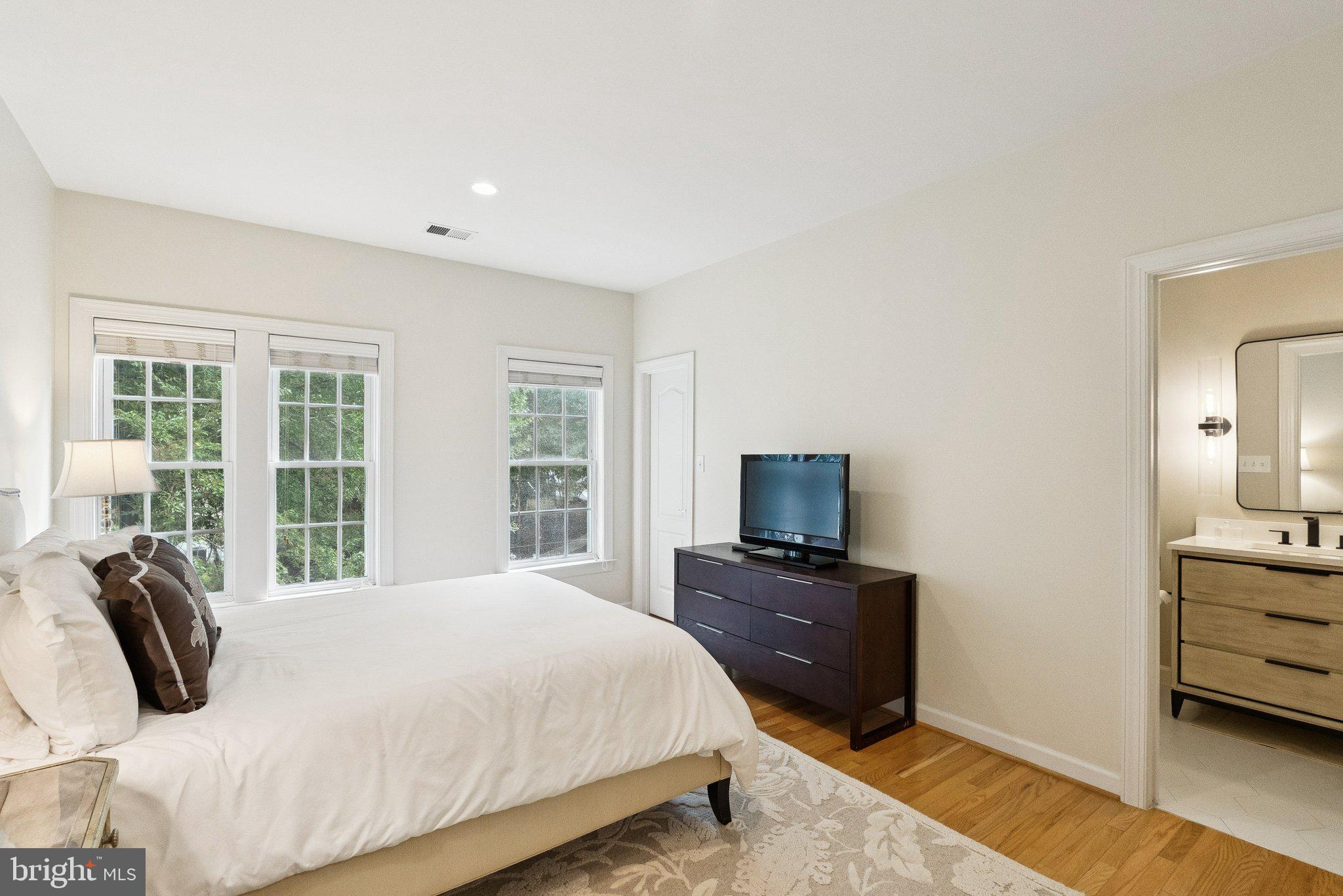 503 Autumn Wind Way Rockville, MD 20850 - Photo 38 of 83 a bedroom with a bed and wooden floor