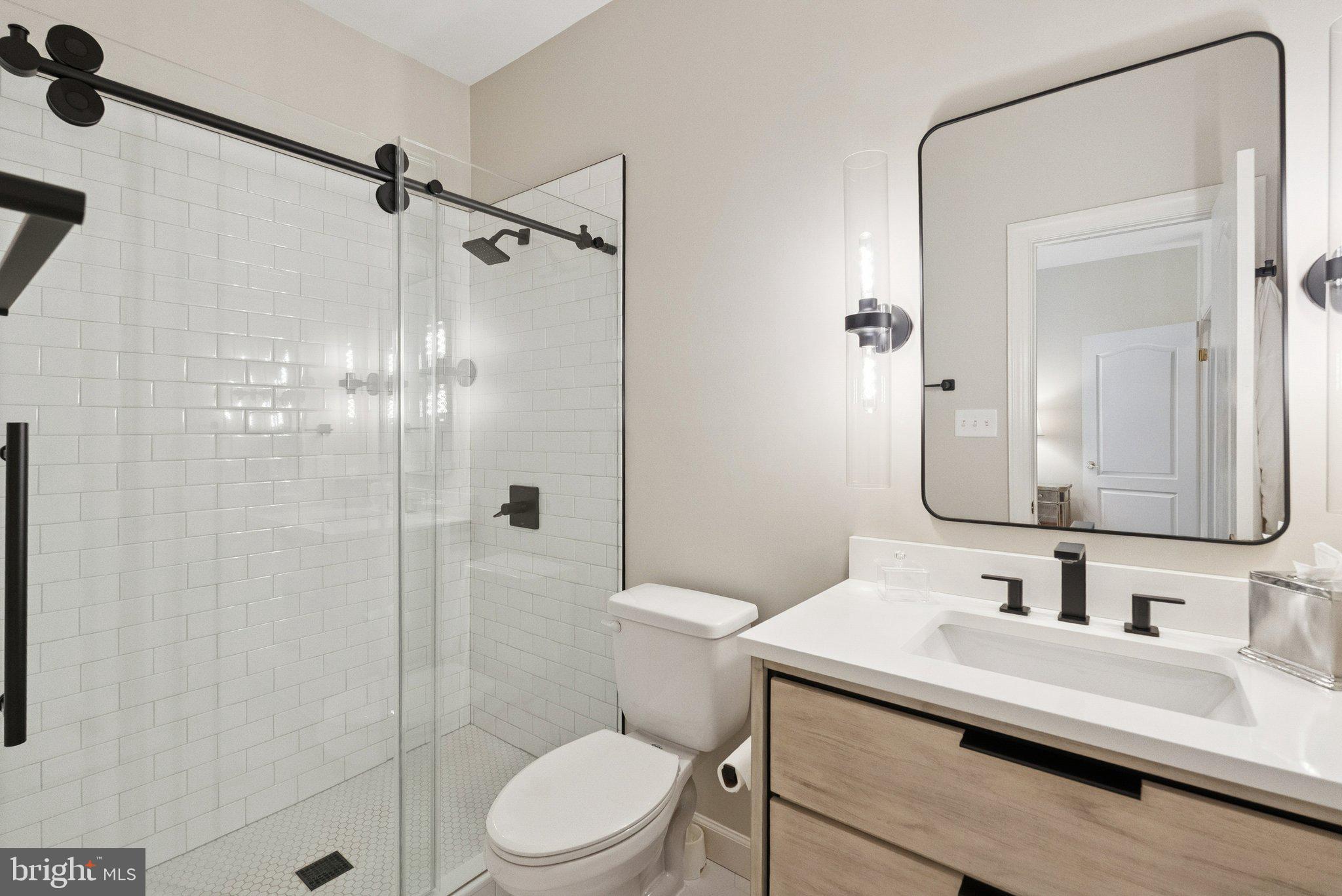 503 Autumn Wind Way Rockville, MD 20850 - Photo 39 of 83 a bathroom with a sink toilet and shower